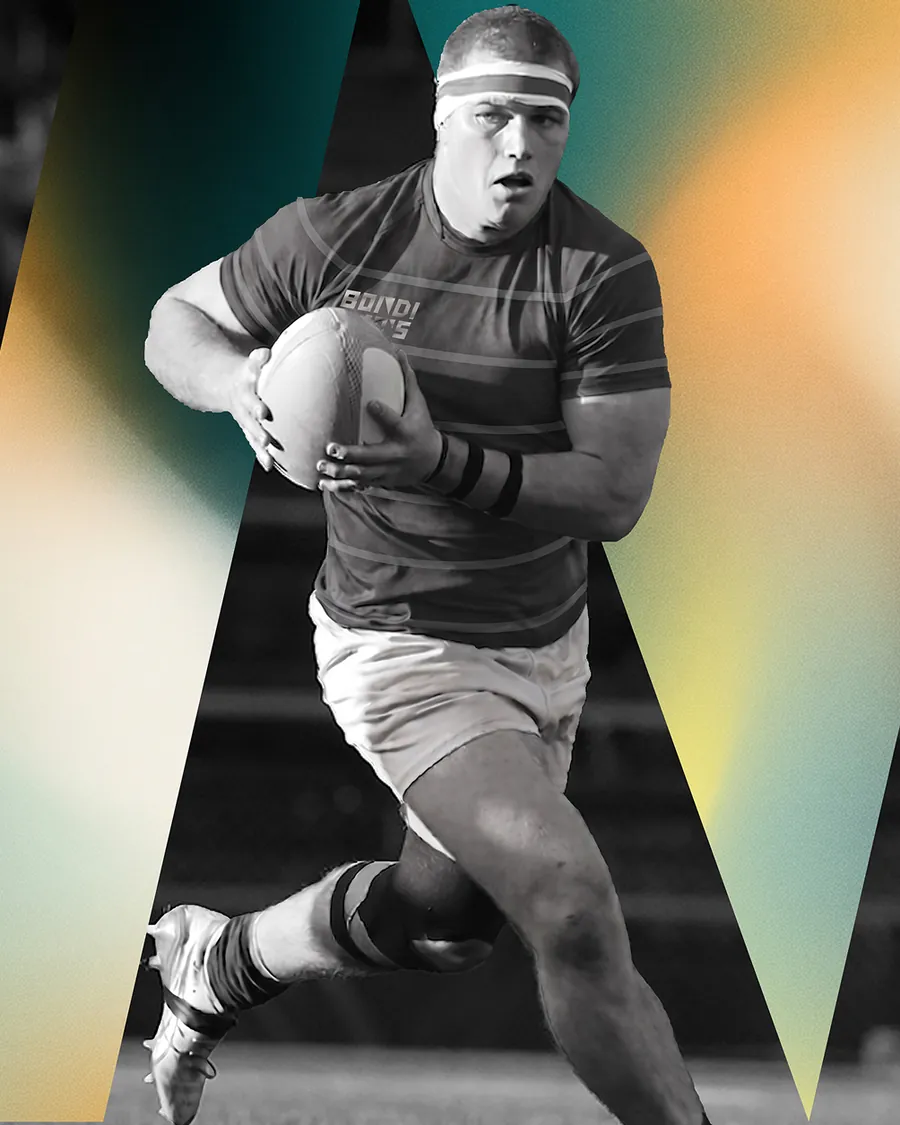 Rugby player running the ball, black and white